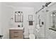 Modern bathroom featuring a walk-in shower with white subway tiles, and modern fixtures at 15776 E 107Th Way, Commerce City, CO 80022