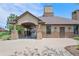 A clubhouse with a covered entryway, stone accents, and a well-maintained exterior at 15776 E 107Th Way, Commerce City, CO 80022