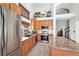 Open-concept kitchen featuring stainless steel appliances and granite countertops with seating at 15776 E 107Th Way, Commerce City, CO 80022