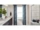Bathroom featuring dual sinks, granite countertops, and a tiled walk-in shower with glass door at 2078 Wagon Wheel Aly, Brighton, CO 80601