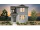 Charming two-story home featuring gray siding, complemented by lush landscaping at 2078 Wagon Wheel Aly, Brighton, CO 80601