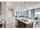 Open-concept kitchen with stainless steel appliances and granite countertops at 2078 Wagon Wheel Aly, Brighton, CO 80601