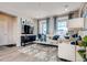 Bright and airy living room featuring contemporary furnishings and large windows at 2078 Wagon Wheel Aly, Brighton, CO 80601