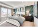The main bedroom boasts a tray ceiling, wainscotting, and large window at 2078 Wagon Wheel Aly, Brighton, CO 80601