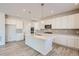 Modern kitchen featuring an island, stainless appliances, and hard surface floors at 14139 Bunny Hop Ln, Parker, CO 80134