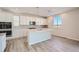 Modern kitchen with stainless appliances, an island, and hard surface floors at 14139 Bunny Hop Ln, Parker, CO 80134