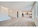 Spacious open floor plan featuring hard surface floors with kitchen and staircase at 14139 Bunny Hop Ln, Parker, CO 80134