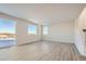 Spacious living area with large windows, hard surface floors, and modern design at 14139 Bunny Hop Ln, Parker, CO 80134