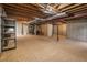 Unfinished basement with exposed ceiling, ductwork and potential for customization at 7915 Flower St # D, Arvada, CO 80005