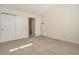 Bedroom with plush carpet, a large closet, and abundant natural light at 7915 Flower St # D, Arvada, CO 80005