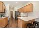 Well-lit kitchen with white countertops, stainless steel appliances, and bar stool seating at 7915 Flower St # D, Arvada, CO 80005