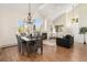 Open concept living room and dining area filled with natural light from large windows at 7915 Flower St # D, Arvada, CO 80005