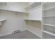 Walk-in closet with built-in shelving and ample storage space, ensuring organization and convenience at 7915 Flower St # D, Arvada, CO 80005