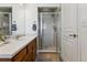 Bathroom with shower stall and wood vanity at 9980 W Jewell Ave # B, Lakewood, CO 80232