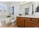 Bathroom with soaking tub, shower, and wood vanity at 9980 W Jewell Ave # B, Lakewood, CO 80232