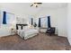 Bright bedroom with vaulted ceilings and carpeted floors at 9980 W Jewell Ave # B, Lakewood, CO 80232
