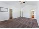 Bright bedroom with carpeting, ceiling fan, and ensuite bathroom access at 9980 W Jewell Ave # B, Lakewood, CO 80232