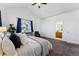 Large bedroom with ensuite bathroom and carpeted floors at 9980 W Jewell Ave # B, Lakewood, CO 80232