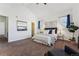 Spacious primary bedroom with vaulted ceilings and carpeted floors at 9980 W Jewell Ave # B, Lakewood, CO 80232