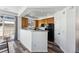 Kitchen with wood cabinets, granite counters and black appliances at 9980 W Jewell Ave # B, Lakewood, CO 80232