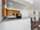 Modern kitchen with wood cabinets and granite countertops at 9980 W Jewell Ave # B, Lakewood, CO 80232
