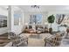 Living room with hardwood floors, neutral decor, and large windows at 9980 W Jewell Ave # B, Lakewood, CO 80232