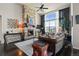 Bright living room with stone fireplace, ceiling fan, and stylish decor at 15290 W Baker Ave, Lakewood, CO 80228