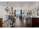 Open-concept living space with modern lighting fixtures and mountain views at 15290 W Baker Ave, Lakewood, CO 80228