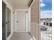 Private balcony with storage and brick exterior at 15700 E Jamison Dr # 7-205, Englewood, CO 80112