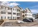 Three-story building with gray and beige exterior at 15700 E Jamison Dr # 7-205, Englewood, CO 80112