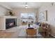 Living room features a fireplace and sliding glass doors to a balcony at 15700 E Jamison Dr # 7-205, Englewood, CO 80112