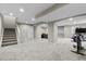 Spacious finished basement with neutral carpet and stairs leading to upper level at 6041 S Salida Ct, Aurora, CO 80016