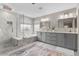 Luxurious bathroom with double vanity, soaking tub and a separate glass-enclosed shower at 6041 S Salida Ct, Aurora, CO 80016
