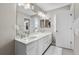 Bright bathroom with double vanity, quartz countertops, and modern fixtures at 6041 S Salida Ct, Aurora, CO 80016