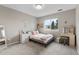 Bedroom with a bed, desk, shelves, and a window with a view of the outdoors at 6041 S Salida Ct, Aurora, CO 80016