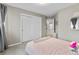 Bedroom with sliding door closet and decorated in neutral tones at 6041 S Salida Ct, Aurora, CO 80016