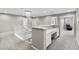 Bright hallway with chandelier, white trim staircase and a built-in desk area at 6041 S Salida Ct, Aurora, CO 80016