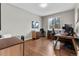 Home office with wood floors, a large desk, and natural light at 6041 S Salida Ct, Aurora, CO 80016