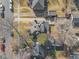 Overhead view of a home with a well-maintained roof, surrounding trees, and neighborhood streets at 1545 Locust St, Denver, CO 80220