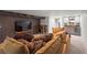 Spacious basement living area with a wet bar, plush sectional, and entertainment area at 1545 Locust St, Denver, CO 80220