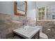 Modern bathroom with marble tile, updated vanity, and a clean, functional design at 1545 Locust St, Denver, CO 80220