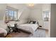Bright bedroom featuring natural light, exercise bike, neutral tones and angled walls at 1545 Locust St, Denver, CO 80220