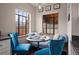 Charming breakfast nook with built-in seating, bright blue chairs, and plenty of natural light, perfect for cozy meals at 1545 Locust St, Denver, CO 80220