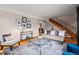Charming living room with staircase, featuring comfortable seating, a decorative rug, and a well-lit atmosphere at 1545 Locust St, Denver, CO 80220
