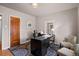 A cozy office space with hardwood floors, natural light, and a functional desk setup at 1545 Locust St, Denver, CO 80220