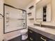 Modern bathroom with a tub, shower, and floating vanity at 4035 S Hazel Ct, Englewood, CO 80110