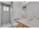 Stylishly designed bathroom featuring tiled walk-in shower and a large mirror above the sink at 4883 W 68Th Ave # 3, Westminster, CO 80030