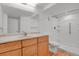 Bathroom features a single sink vanity and walk-in shower with a white shower surround at 4883 W 68Th Ave # 3, Westminster, CO 80030