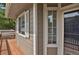 Exterior view featuring the deck with brown wood, window with white trim, and brown siding at 4883 W 68Th Ave # 3, Westminster, CO 80030