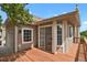 Exterior showing sliding glass doors onto a wood deck and a detached two-car garage at 4883 W 68Th Ave # 3, Westminster, CO 80030